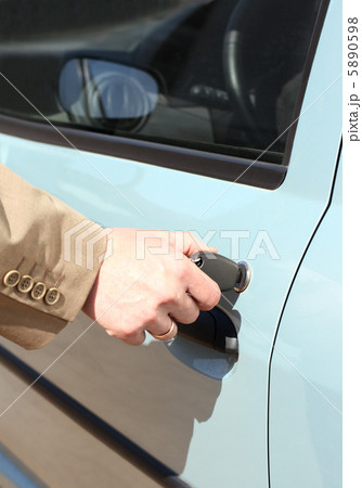 men hand with key open car door men hand with key open car door 5890598