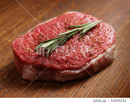 fresh raw steak with pepper and rosemary fresh raw steak with pepper and rosemary 5899292