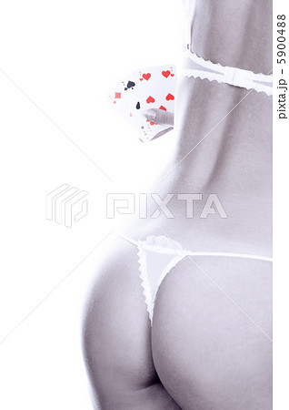 Beautiful girl holding three of a kind sevens 5900488