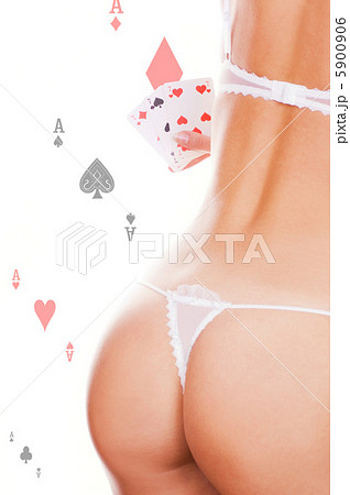 Beautiful girl holding three of a kind sevens 5900906