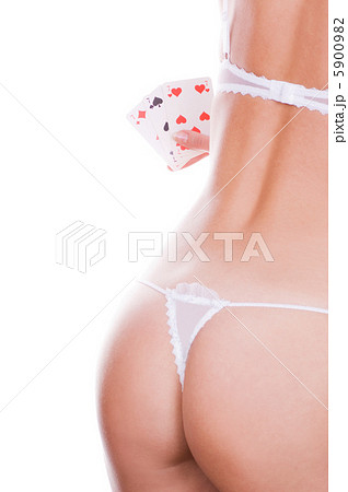 Beautiful girl holding three of a kind sevens 5900982