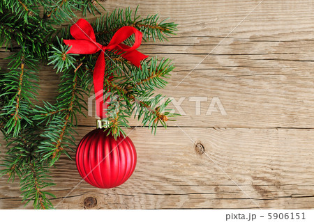 Spruce branches with christmas decoration on wooden background 5906151