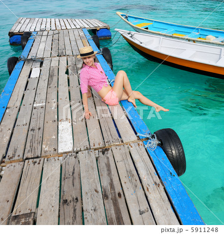 Woman at beach jetty 5911248