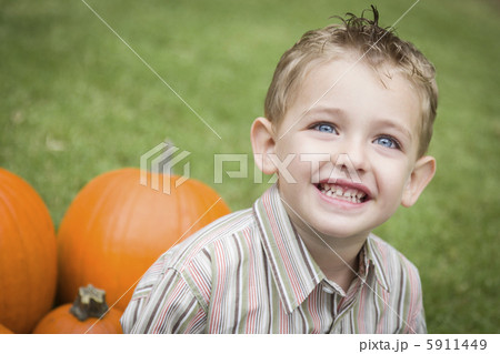 Cure Young Child Boy Enjoying the Pumpkin Patch. 5911449