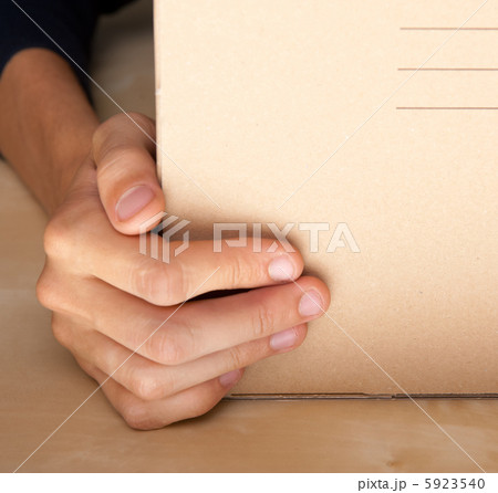 Successful Postal or delivery service concept. Man holding cardb 5923540