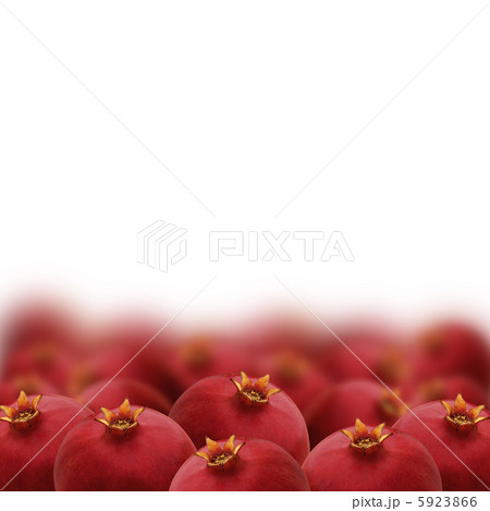 Bright red pomegranates isolated on white background Bright red pomegranates isolated on white background 5923866