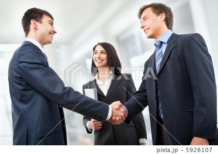Business people shaking hands 5926107