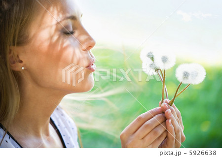 Young woman with dandelions 5926638