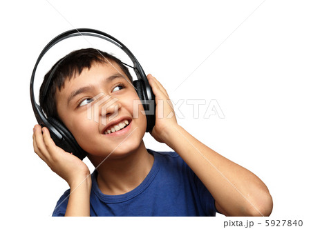 boy listening music in headphones boy listening music in headphones 5927840
