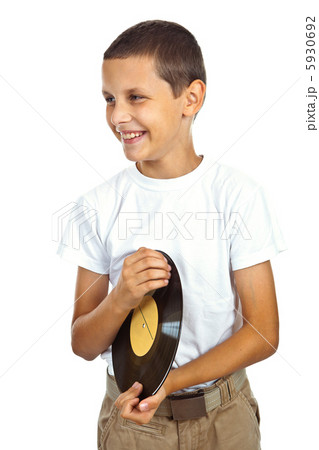 Boy in white shirt holding vinyl record Boy in white shirt holding vinyl record 5930692