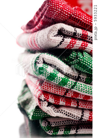 Folded cloth pieces over white background Folded cloth pieces over white background 5933221