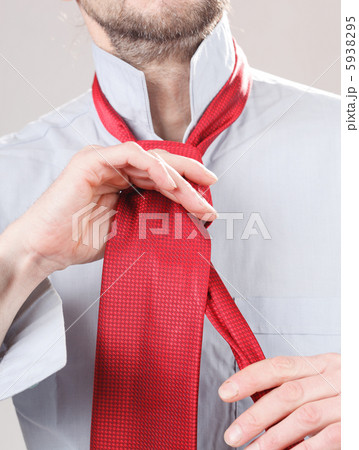 Man adjusting tie Man adjusting tie 5938295