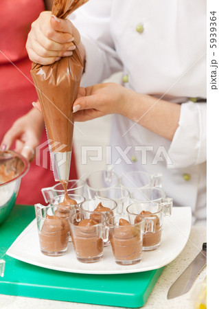 chef making a chocolate mousse chef making a chocolate mousse 5939364