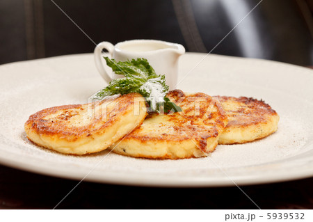 Cheese pancakes with sour cream Cheese pancakes with sour cream 5939532