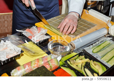 chef preparing sushi in the kitchen chef preparing sushi in the kitchen 5950611
