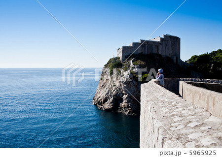 Woman looking over the sea Woman looking over the sea 5965925