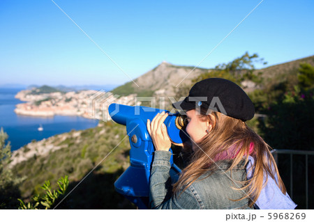 Tourist using telescope Tourist using telescope 5968269
