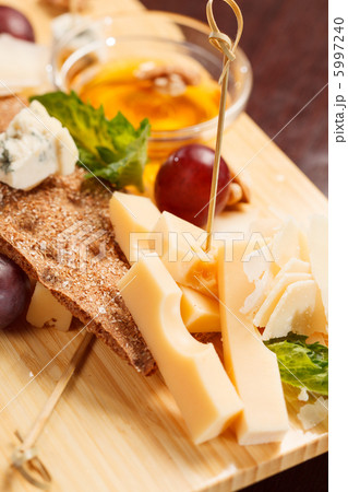 Cheese plate with grapes and honey Cheese plate with grapes and honey 5997240