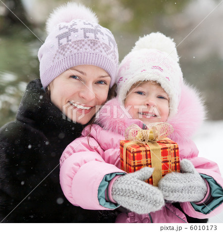 Happy family with Christmas gift Happy family with Christmas gift 6010173
