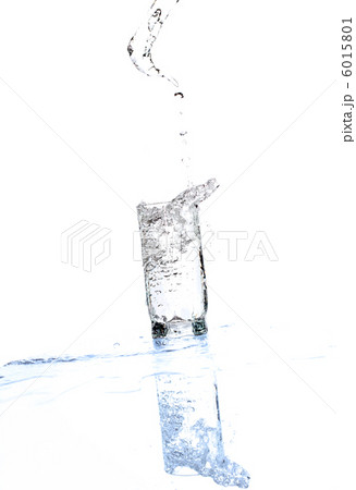 Water streaming from bottle isolated on white 6015801
