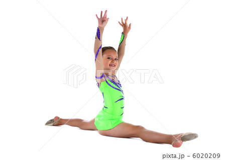 Young teen gymnast doing split in green costume 6020209