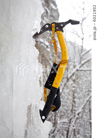Climbing ice ax in the white ice Climbing ice ax in the white ice 6021902