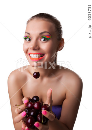 Smile funny woman eat one of two ripe cherry 6033751