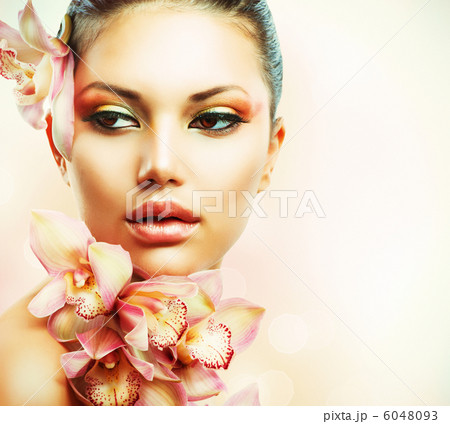 Beautiful Girl With Orchid Flowers. Beauty Woman Face Beautiful Girl With Orchid Flowers. Beauty Woman Face 6048093