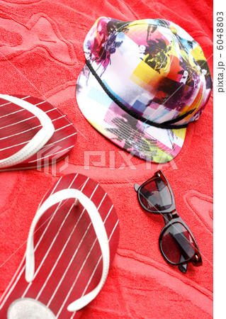 Flip flops, sunglasses and a cap Flip flops, sunglasses and a cap 6048803