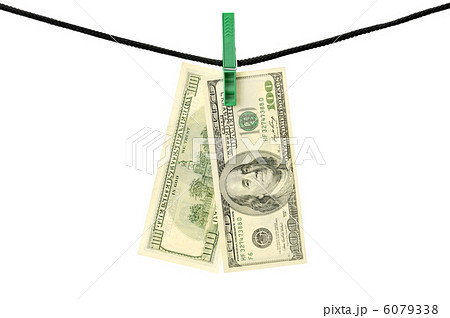 Dollars hanging on a string isolated on white background Dollars hanging on a string isolated on white background 6079338
