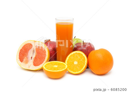 Glass with juice and fruits isolated on white background Glass with juice and fruits isolated on white background 6085200