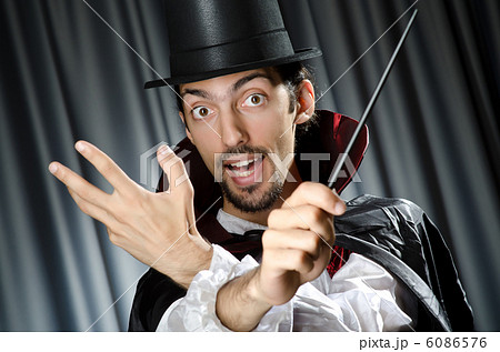 Magician doing tricks on white 6086576