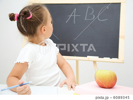 Little girl is studying Little girl is studying 6089345