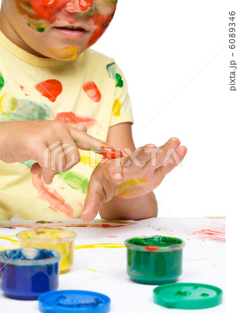 Portrait of a cute girl playing with paints Portrait of a cute girl playing with paints 6089346