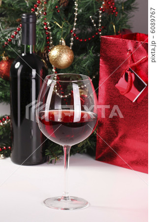red wine, christmas tree and bag with gift 6089767