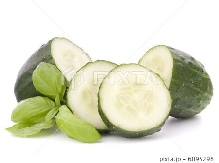 Sliced cucumber vegetable and basil leaves still life 6095298