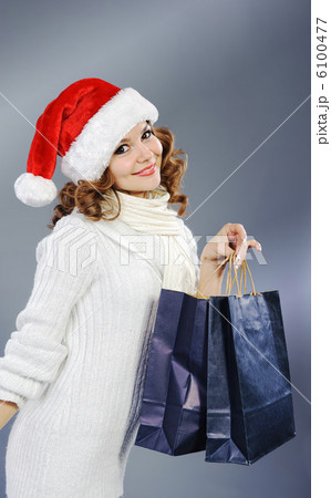 Beautiful young woman with shopping bags Beautiful young woman with shopping bags 6100477