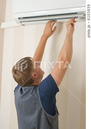 man repair air-conditioner man repair air-conditioner 6103839