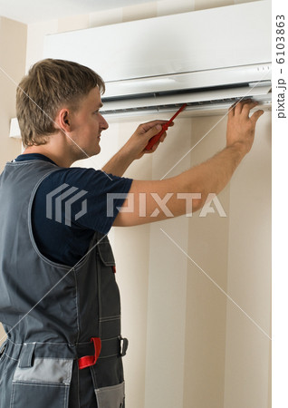 man repair air-conditioner 6103863