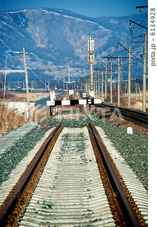 railroad ending deadlock in the winter mountains in the background railroad ending deadlock in the winter mountains in the background 6134928