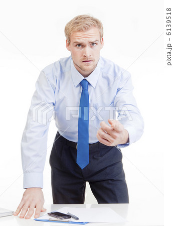 angry boss behind desk 6139518