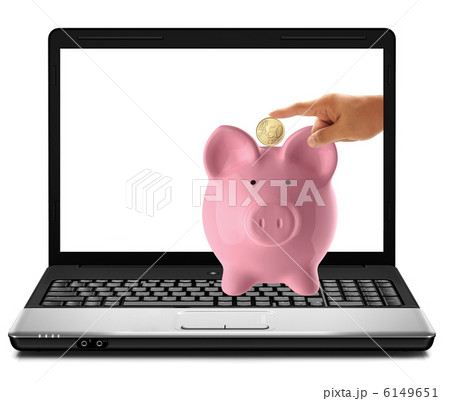hand inserting a coin into a laptop 6149651