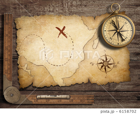 aged brass antique nautical compass on table with old treasure m aged brass antique nautical compass on table with old treasure m 6158702