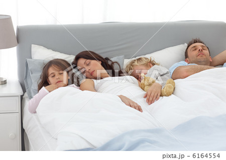 Relaxed family doing a nap together 6164554