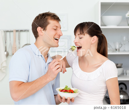 Happy couple eating together 6165018