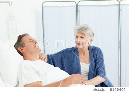Mature woman taking care of her husband Mature woman taking care of her husband 6166405