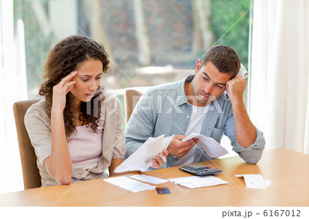 Young couple calculating their domestic bills 6167012