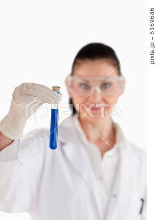 Dark-haired woman conducting an experiment 6169686
