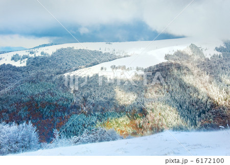 First winter snow in mountain and inclement windy weather beginn First winter snow in mountain and inclement windy weather beginn 6172100