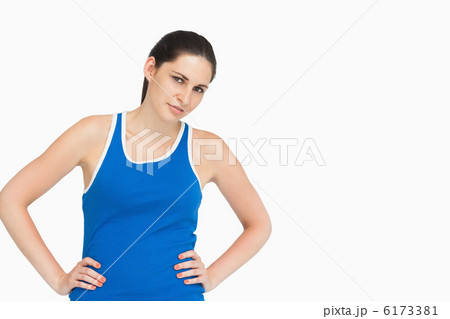 Serious brunette in sportswear hands on hips Serious brunette in sportswear hands on hips 6173381